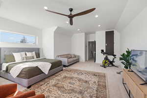 Bedroom featuring a ceiling fan, light colored carpet, recessed lighting, and lofted ceiling