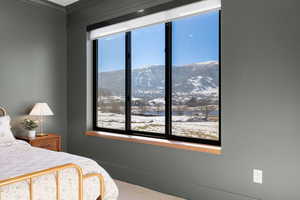 Bedroom with a mountain view and carpet floors