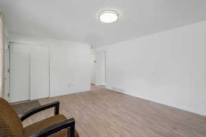 Unfurnished room featuring light wood-style flooring and baseboards