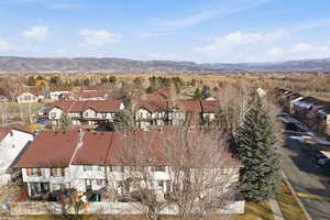 Aerial view of residential area featuring a mountain backdrop