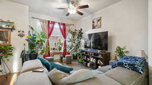 Living room featuring ceiling fan