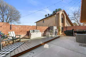 Fenced backyard featuring a deck