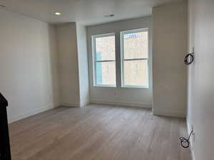 Living room featuring light wood-style floors and recessed lighting