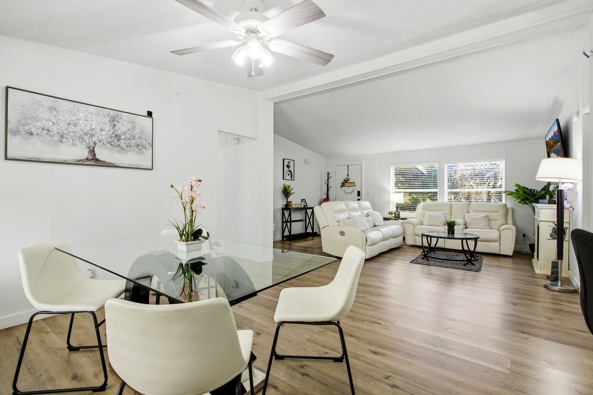 Dining area featuring wood finished floors and ceiling fan