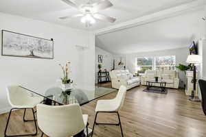 Dining area featuring wood finished floors and ceiling fan