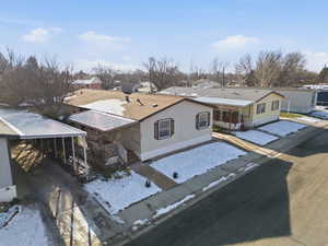 Snowy aerial view with a residential view