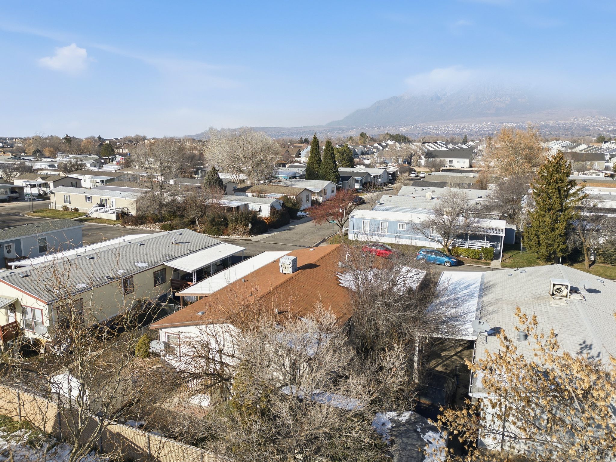 Aerial view of residential area featuring a mountain backdrop