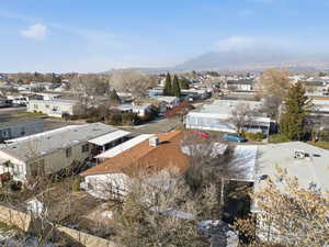 Aerial view of residential area featuring a mountain backdrop