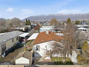 Aerial perspective of suburban area featuring a mountain backdrop