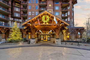 Property at dusk with a view of apartment building / complex