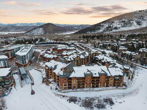 Snowy aerial view featuring a mountain view