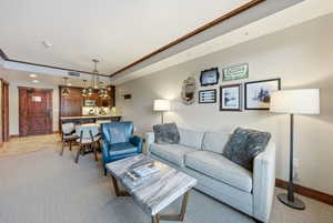 Living area featuring baseboards and recessed lighting