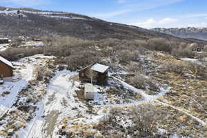Snowy aerial view featuring a mountain view