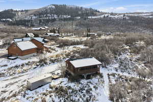 Snowy aerial view featuring a mountain view