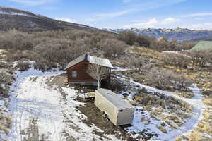 Snowy aerial view with a mountain view
