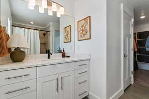 Full bathroom featuring vanity, recessed lighting, a spacious closet, a shower with shower curtain, and tile patterned floors