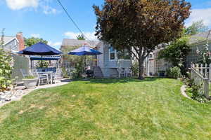 Fenced backyard with a gazebo and a patio area
