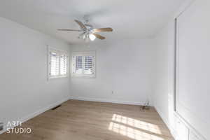 Unfurnished room featuring light wood finished floors and a ceiling fan