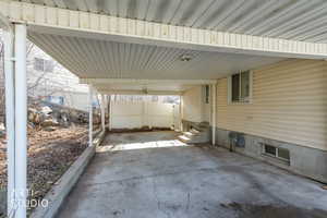 View of patio featuring a carport and entry steps