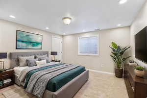 Bedroom with recessed lighting and light carpet