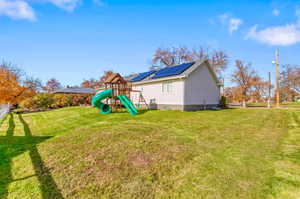 View of green lawn with a playground