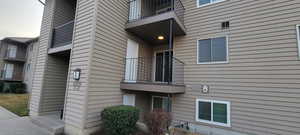 View of property exterior featuring a balcony