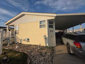 View of home's exterior with a carport