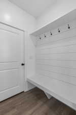 Mudroom with dark wood finished floors
