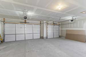 Garage featuring a garage door opener