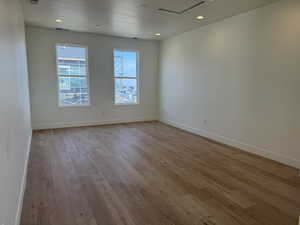 Sky Room- featuring light wood-type flooring, a textured ceiling, and recessed lighting