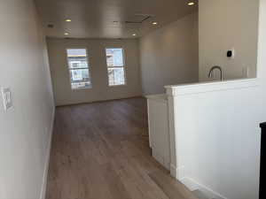 Sky Room- featuring light wood-type flooring, a textured ceiling, and recessed lighting