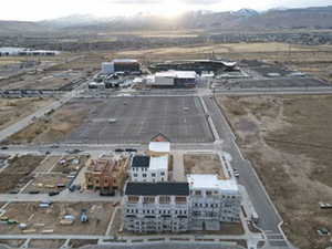 Drone / aerial view of a mountainous background and an industrial area