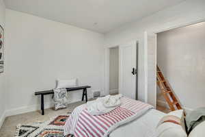Bedroom with carpet flooring and a closet