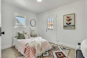 Carpeted bedroom with baseboards