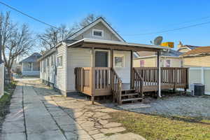 Back of house featuring a deck