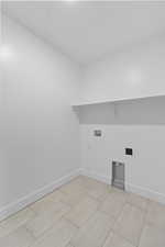 Laundry room with washer hookup and hookup for an electric dryer