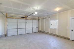 Garage featuring a garage door opener