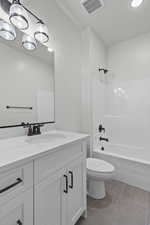 Bathroom with vanity, shower / washtub combination, light tile patterned flooring, and recessed lighting