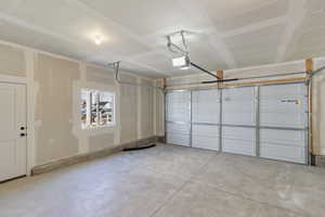 Garage featuring a garage door opener