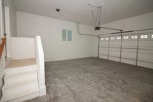 Garage featuring a garage door opener