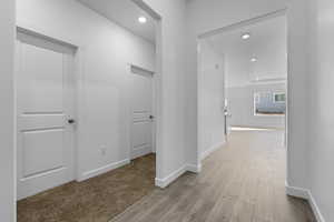 Hall featuring recessed lighting and light wood finished floors