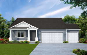 View of front facade with a front lawn, driveway, and a garage