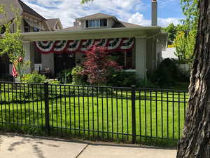 Bungalow-style house with brick siding and a chimney