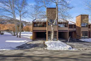 View of front facade featuring a balcony and stucco siding