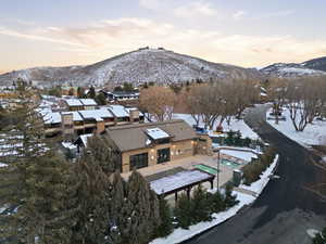 Snowy aerial view featuring a mountain view