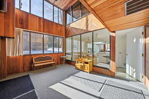 View of patio / terrace featuring a sunroom