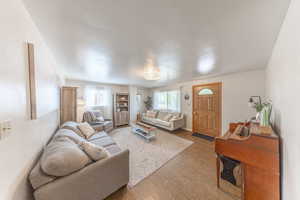 Living room with wood finished floors and baseboards