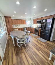 Kitchen with lots of counter space and rich wood cabinets
