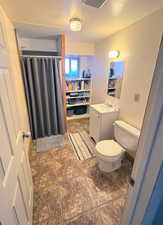 3/4 Bathroom in the Basement with lots of shelves