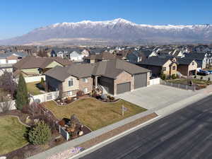 Aerial perspective of suburban area with a mountainous background